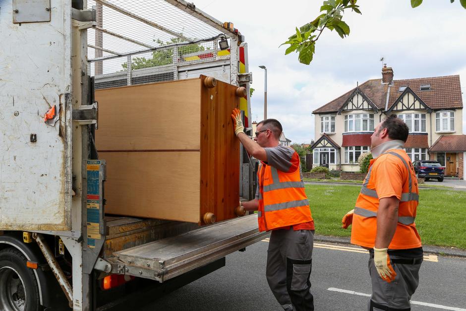 Item being loaded in collection vehicle